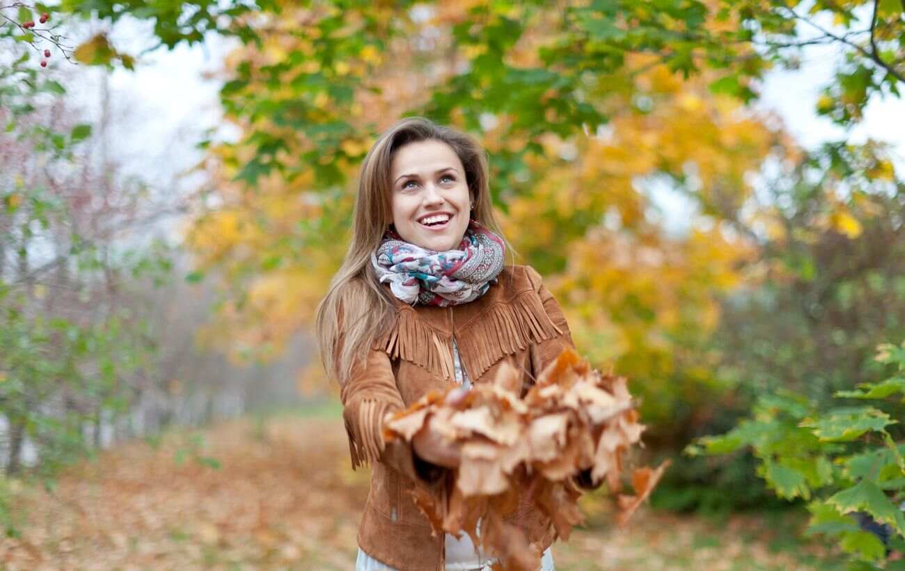 happy woman autumn park 076c752f